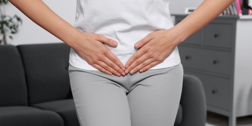 Woman holding lower stomach